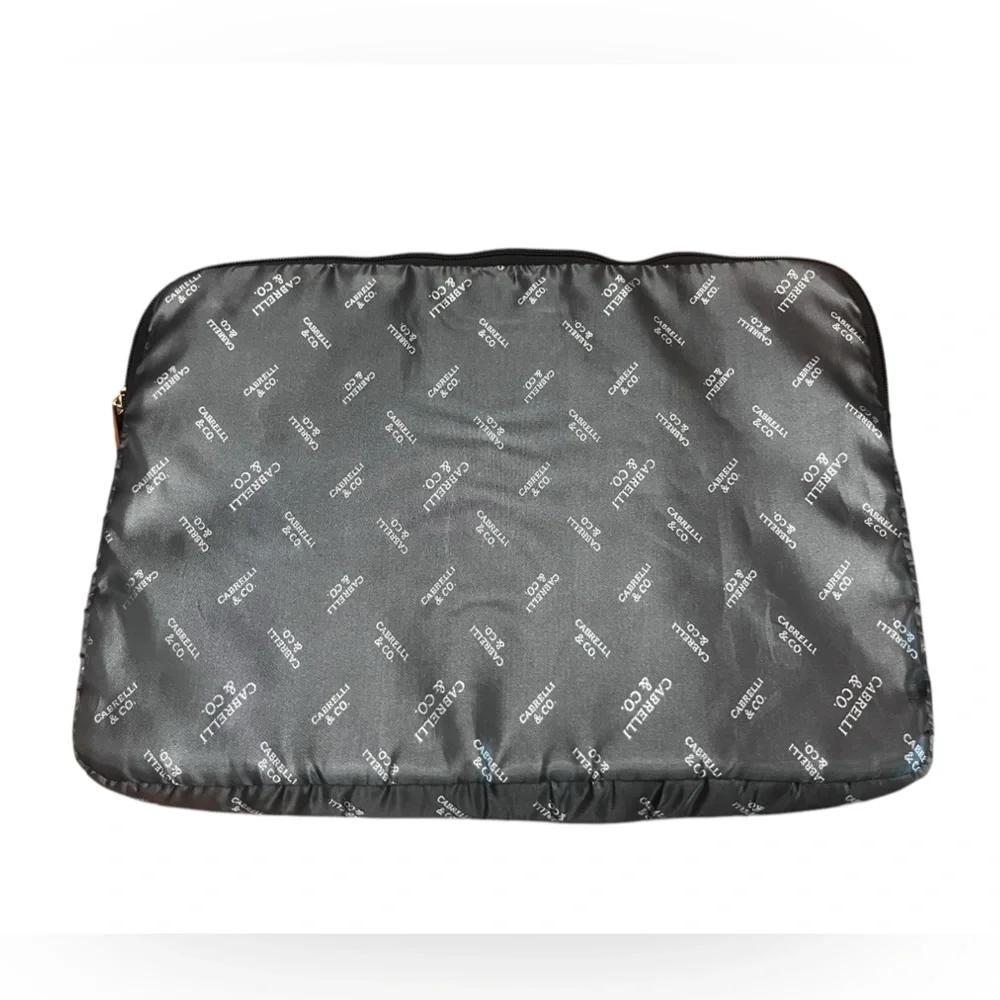 Silver and black Cabrelli & CO. inner laptop case